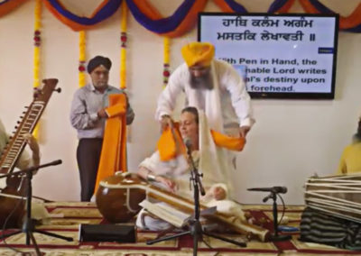 Dr. Cassio performing kirtan at Hicksville Gurdwara NY with Parminder Singh Bhamra (pakhawaj) and Nirvair Kaur Khalsa (taus)
